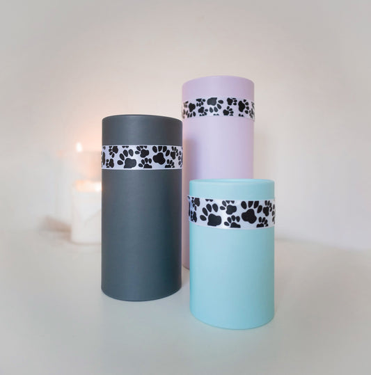 Perfect choice for those wishing to scatter or bury their pets ashes in a special area or spot. The tube is a simple and sturdy design, allowing you to return your cherished pet to the earth with grace and respect.
Our recyclable scatter tube comes in a choice of three beautiful colours and features a cute paw print ribbon adding a special touch.
