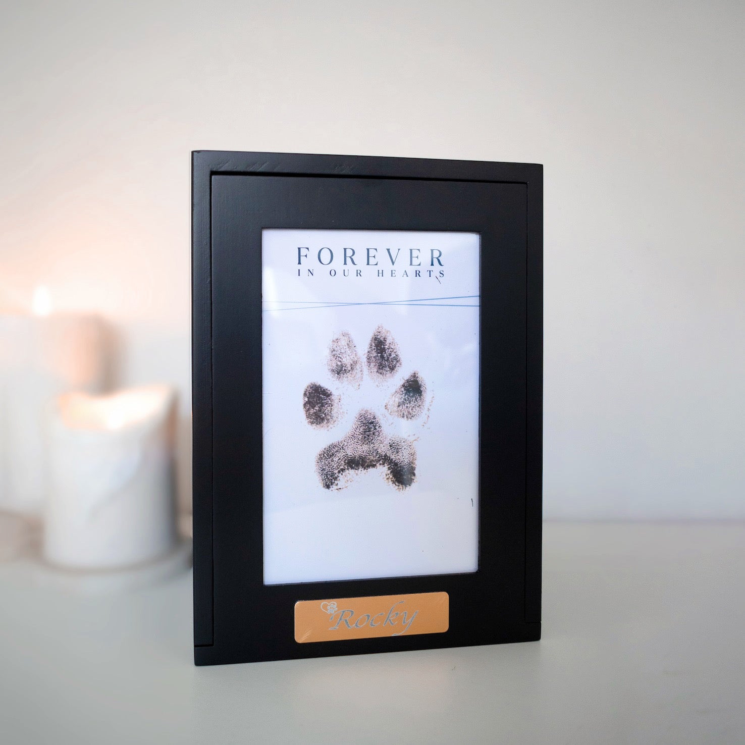 A simple but elegant wooden urn showcasing your pet with a dedicated space for their photo, allowing you to celebrate your pet's unique spirit. This urn is a timeless, elegant design and would look good in any niche or spot in any household. We also include an engraved gold plaque with your treasured pet's name.

There is also the option of omitting the photo and replacing with your pets ink paw print. Just as personal and entirely your choice.