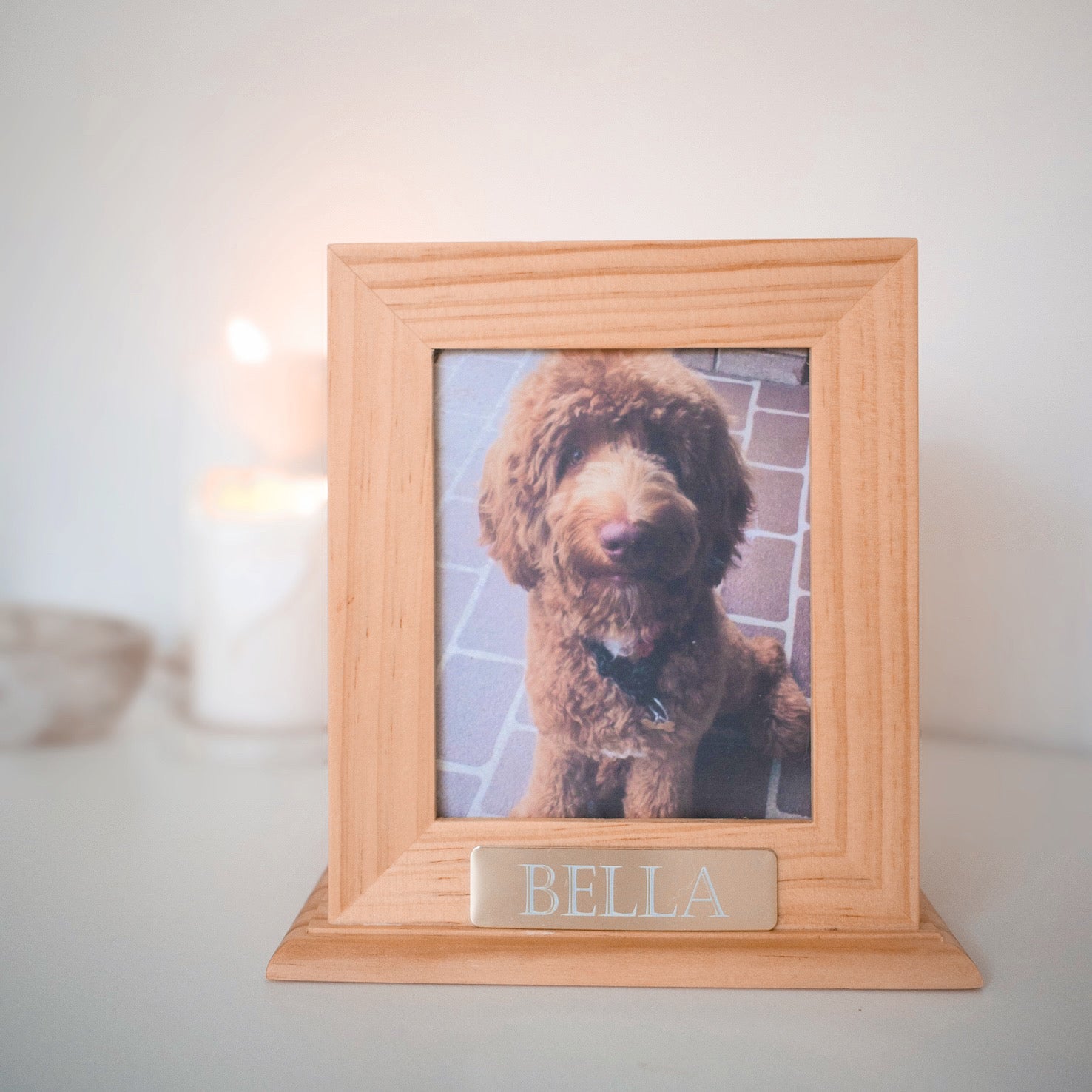 A simple but elegant wooden urn showcasing your pet with a dedicated space for their photo, allowing you to celebrate your pet's unique spirit. This urn is a timeless, elegant design and would look good in any niche or spot in any household. We also include an engraved gold plaque with your treasured pet's name.

There is also the option of omitting the photo and replacing with your pets ink paw print. Just as personal and entirely your choice.